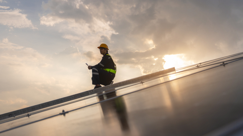 Techniques checking solar cell on the roof for maintenance. Service engineer worker install solar panel. Clean energy concept.